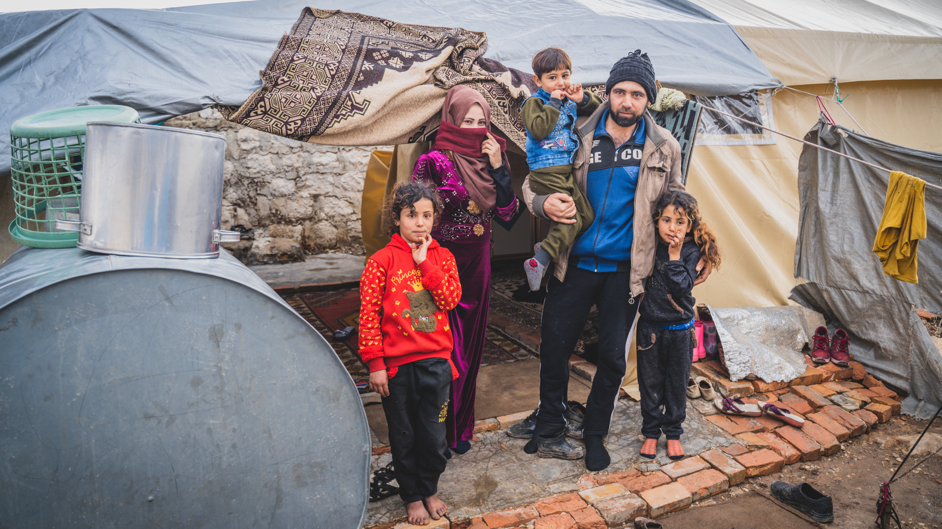 Displaced families in flimsy shelters facing sub-zero temperatures