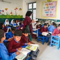 A teacher teaches children in a Muslim Hands' classroom