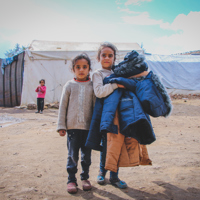 Providing warm coats and shoes to help families survive freezing conditions