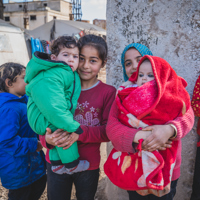 A moment of relief. Children wrapped in warmth thanks to your generosity