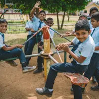 Children at a Muslim Hands' School of Excellence play on the playground